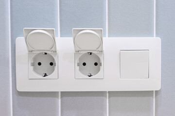 Horizontal block of two sockets and a switch. Bathroom socket, waterproof, double for washing...