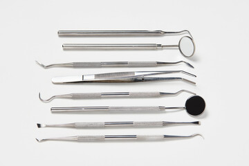 Professional Dentist tools on white background with copy space