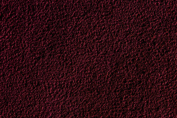 Crimson colored wall background with textures of different shades of crimson red
