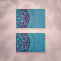 Business card in turquoise color with abstract purple ornament for your personality.