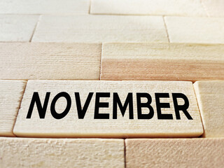 November text on wooden background. Season concept. Stock photo.