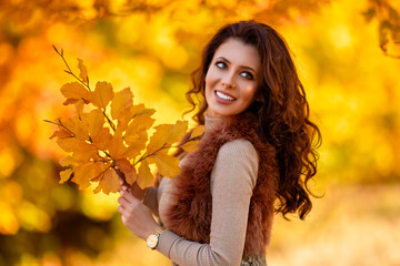portrait of a beautiful woman in the woods in autumn season