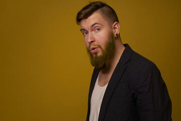 bearded man fashionable hairstyle jacket posing self confidence