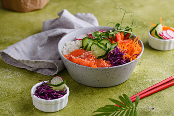 Hawaiian poke bowl with salmon, rice and vegetables