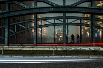 The illuminated Speicherstadt in Hamburg in dense fog