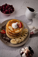 pancake whipped cream fruits and chocolate sauce 