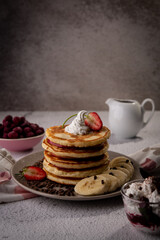 pancake whipped cream fruits and chocolate sauce 