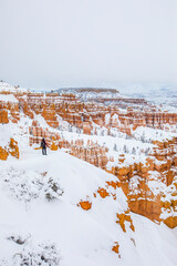 Hiker girl in winter in Bryce Canyon National Park, United States Of America