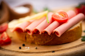 sandwich in traditional style on wooden plate