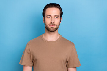 Photo of attractive confident young man wear casual brown outfit isolated blue color background