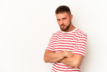 Young caucasian man with diastema isolated on white background frowning face in displeasure, keeps...