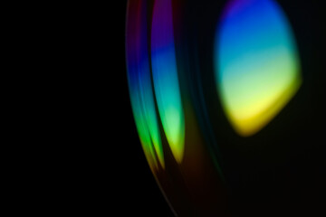 Closeup soap bubble like reflection from lens on dark background. Abstract multicolor psychedelic alien planet