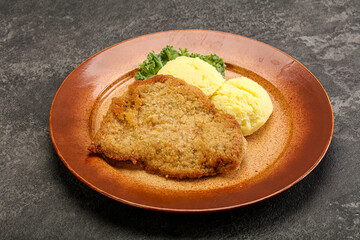 Crispy chicken schnitzel with mashed potato