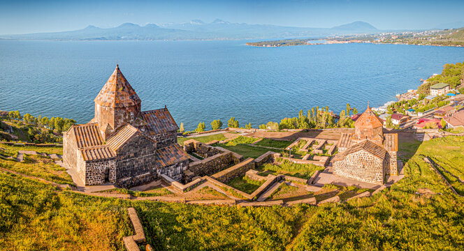 Aerial panoramic view to Sevanavank Monastery and chapel overlooking famous Sevan lake at sunny spring day. Travel and tourist destinations of Armenia