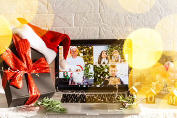 Naklejka na ściany i meble video call celebrating christmas by laptop online during coronavirus outbreak