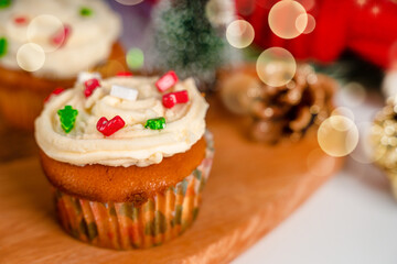 Cupcakes decorated with sprinkles in the form of a Christmas tree. Festive sweet treats, Christmas dessert