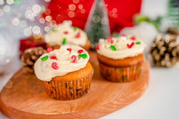 Cupcakes decorated with sprinkles in the form of a Christmas tree. Festive sweet treats, Christmas dessert