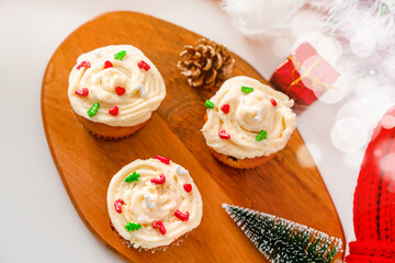 Cupcakes decorated with sprinkles in the form of a Christmas tree. Festive sweet treats, Christmas dessert