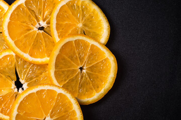 Orange slices on a dark background