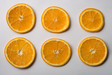 Six orange slices on a white background