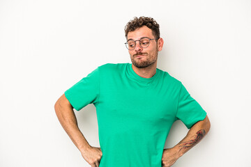 Young caucasian man isolated on white background dreaming of achieving goals and purposes