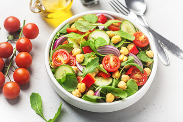 Vegetarian chickpea beans salad prepared with tomatoes and cucumber