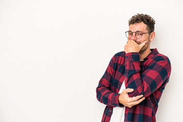 Young caucasian man isolated on white background laughing happy, carefree, natural emotion.