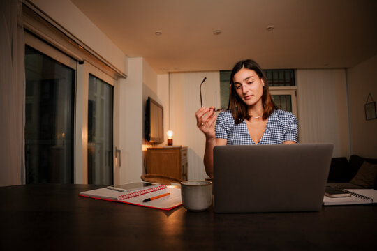 Caucasian Female Working Late At Night From Home Studying For Upcoming Exams