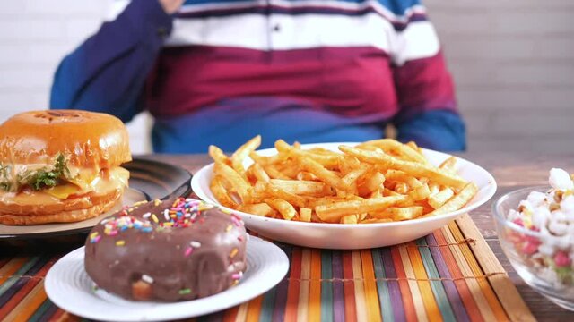 hungry man junk food on table 