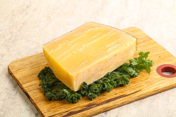 Parmesan cheese piece over board