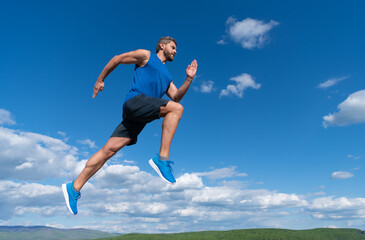 Fototapeta na wymiar workout activity. healthy man jumping. fitness guy in sportswear. full of energy.