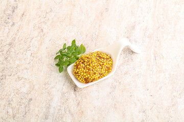 Grain mustard sauce in the bowl