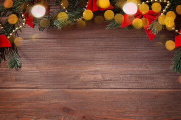 Christmas top border with Christmas decorations and bokeh on wooden background, mockup, flat lay, copy space