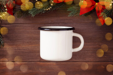 Christmas white enamel mug mockup with Christmas decorations and bokeh on wooden background, mockup, flat lay, copy space
