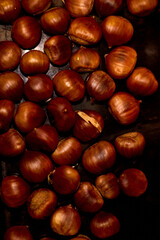 Chestnuts, maroni roasted chestnuts, popular autumn street food in Europe.