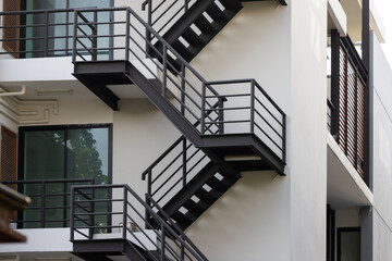 fire escape stair steel. black outdoor metal stair of building.