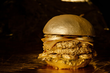 large, juicy and expensive burger with gilding