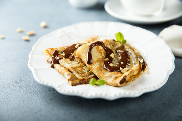 Homemade crepes with chocolate sauce