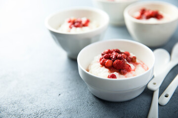 Traditional homemade rice pudding with wild strawberry
