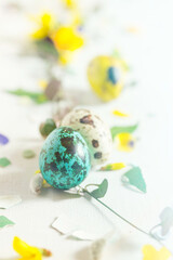 Modern Easter decor concept. Bright color quail eggs on white table - obrazy, fototapety, plakaty