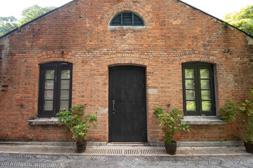 Fototapeta na wymiar Facade and exterior of historical old brick house