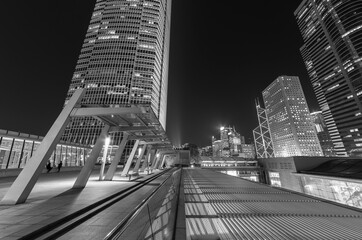 Modern office building and skyline of Hong Kong city at night
