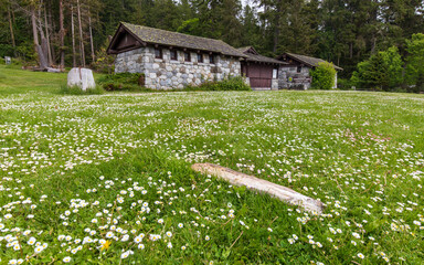 Stone house and meadow at Bowman Bay Deception Pass State Park in Washington during summer.