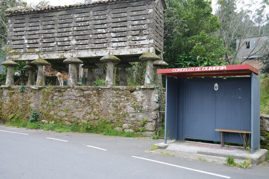 Typical stone grain deposit next to bus stop on a route