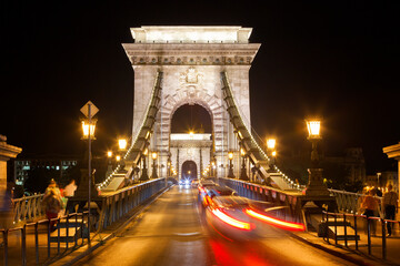 Night traffic of cars on Secheni Bridge through Danube in Budapest