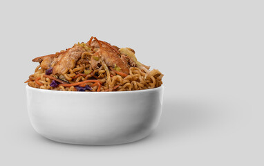 Chicken Yakisoba noodles in bowl. Japanese food. Isolated on background.