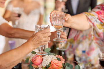 people holding glasses of champagne