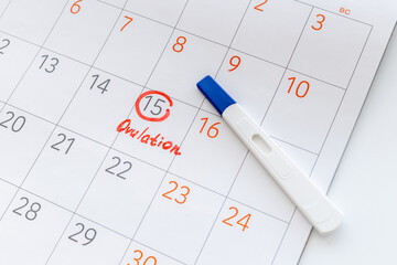 Ovulation day mark in calendar with ovulation home test