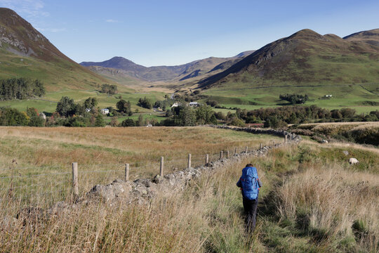 Young hiker on walking path to Spittal of Glenshee. Cateran Trail, Scotland.