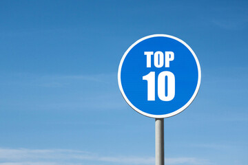 'Top 10' sign in blue round frame on sky background